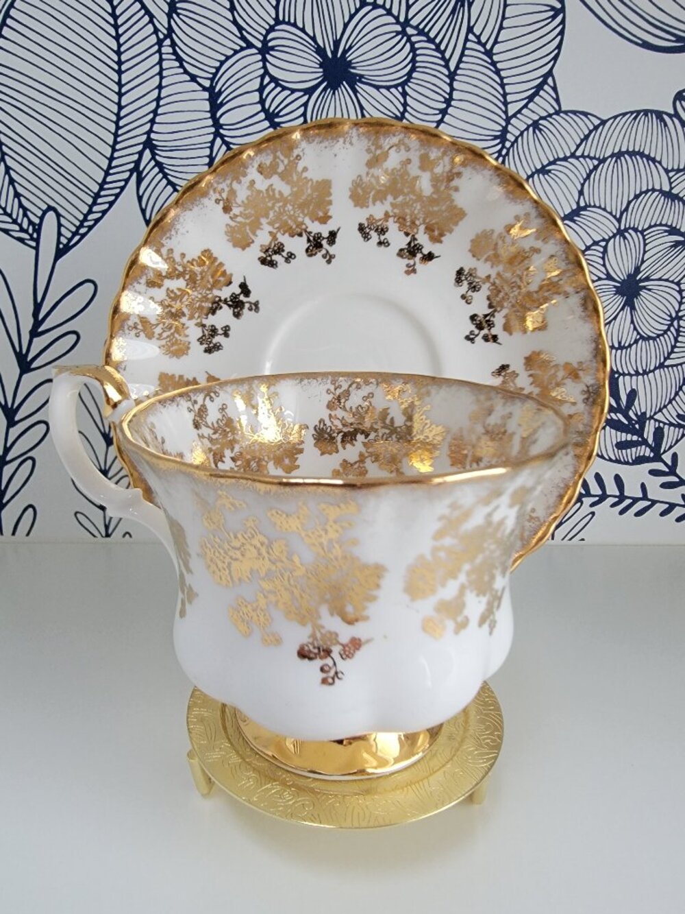 Royal Albert teacup & saucer, gold floral/leaf pattern with gold foot, England